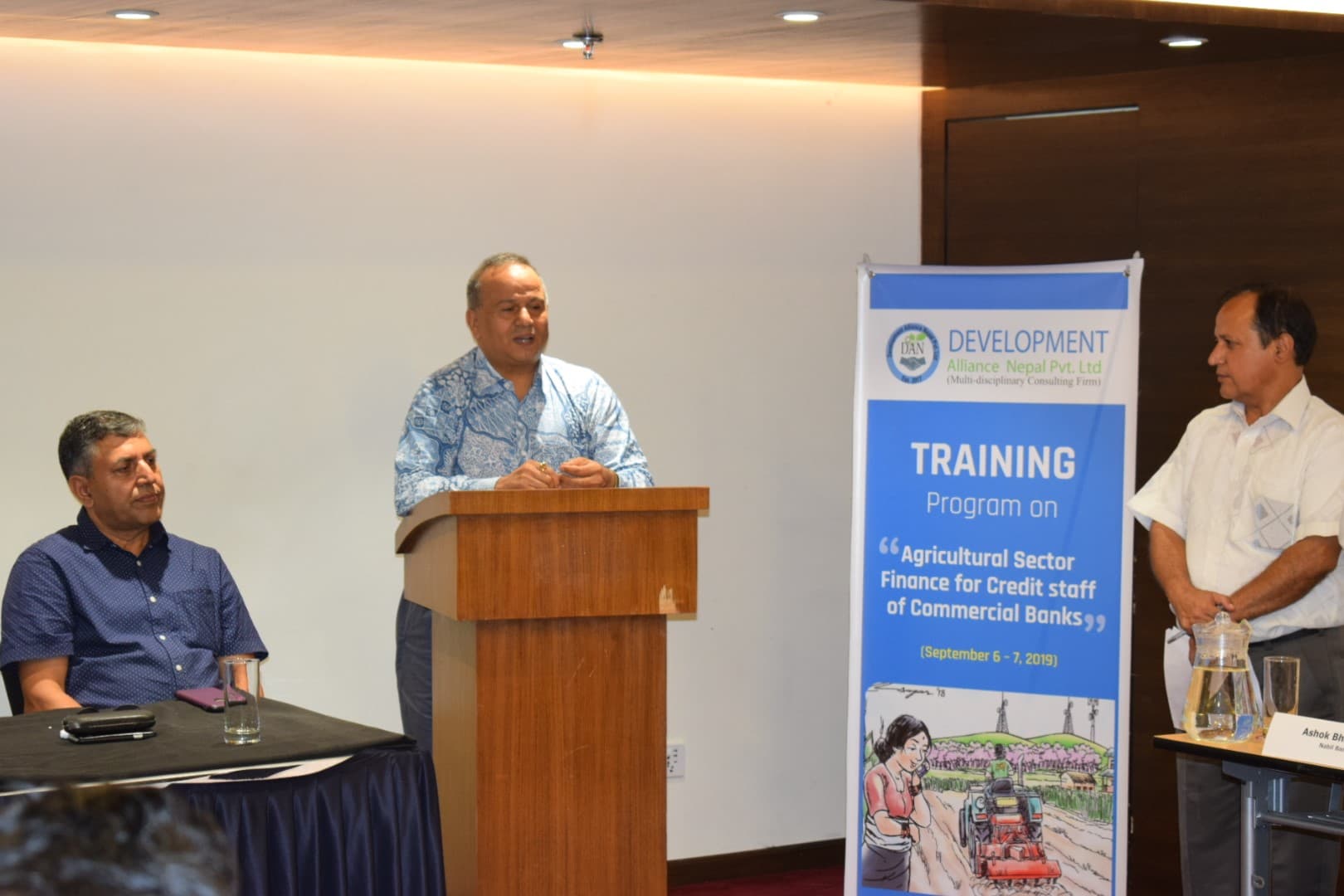 A speaker presenting during a training session