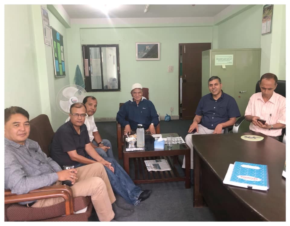 Participants seated together in a small meeting room