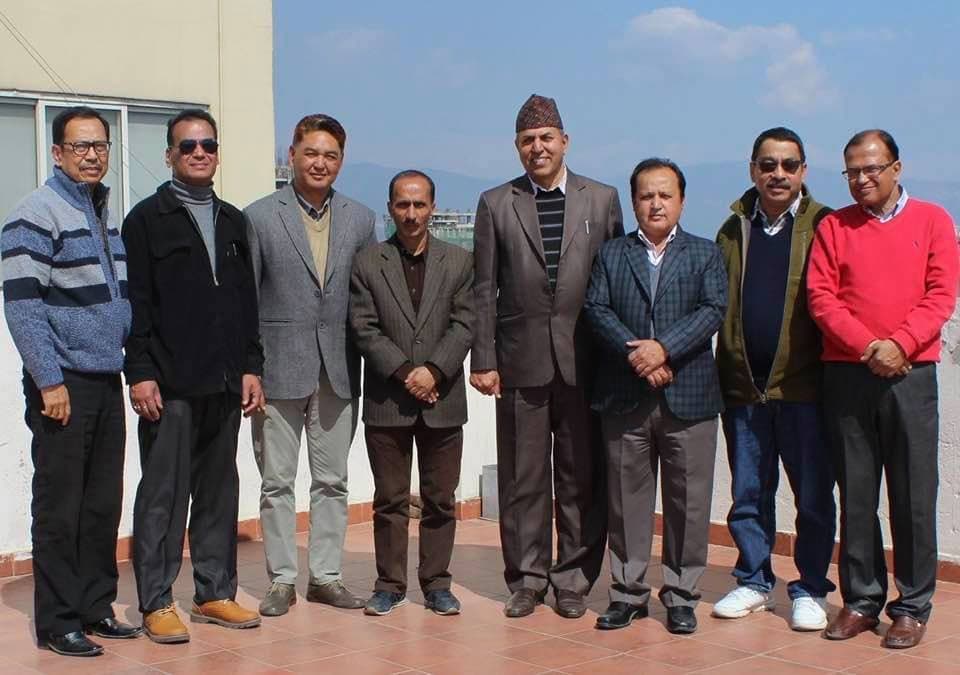 A group posing together outdoors after a training activity
